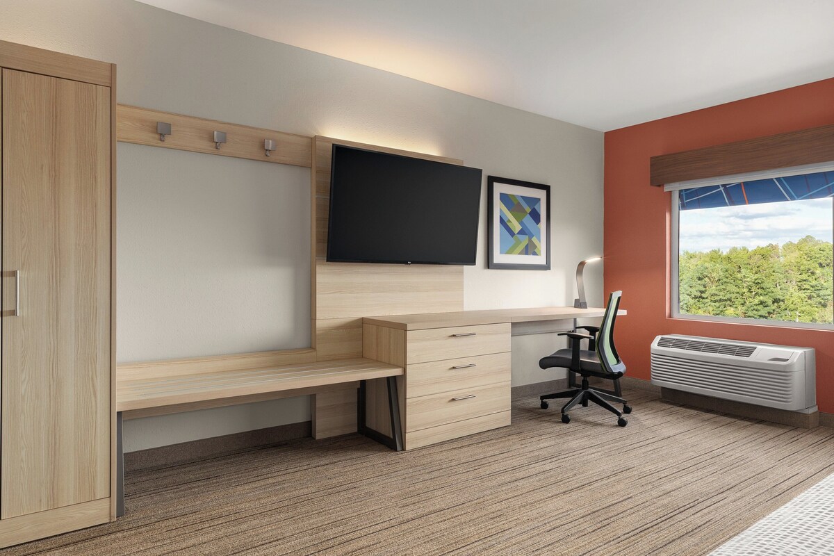 Desk, laptop workspace, blackout drapes, iron/ironing board