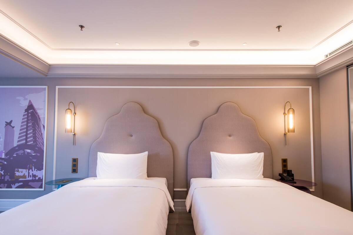 Deluxe Room, 2 Twin Beds | Down comforters, in-room safe, desk, laptop workspace