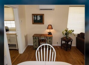 Cozy living space with a dining area, kitchenette, and comfortable seating.