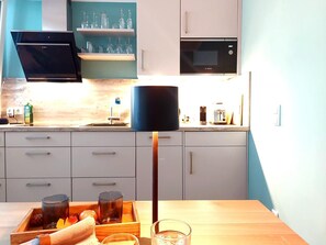 Fridge, microwave, electric kettle, cookware/dishes/utensils