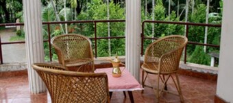 Farm stay with abundant fruit plants.