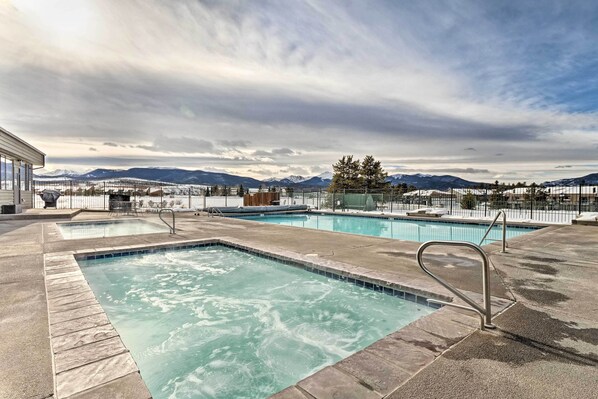 Relax by the pool with a breathtaking view of the surrounding mountains.