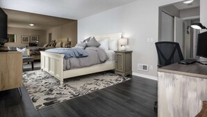 A bedroom with a bed, bedside tables, a desk, and a chair. - Spectacular Views, Single Level w/ Huge Deck & BBQ, Pet Friendly, Next to Forest Park Hiking Trails (Portland)