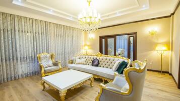 Apartment, 3 Bedrooms | Living room | Flat-screen TV