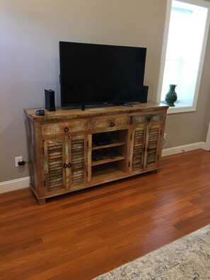 Entertainment center with flat-screen TV and ample storage.
