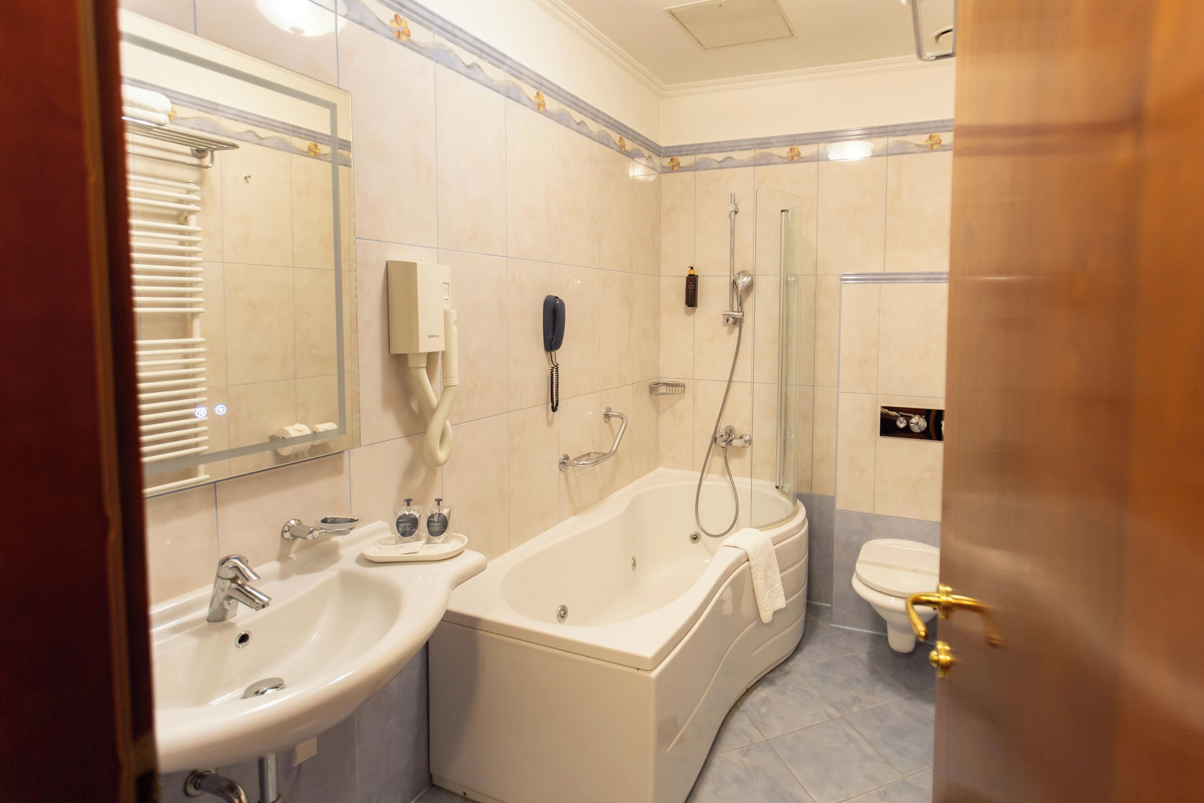 hair dryer, bathrobes, slippers, towels