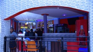 A bar area with seating and a Pepsi refrigerator. - Golden View Hotel Ibanda (Ibanda)