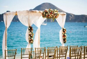 On the beach, sun loungers, beach towels