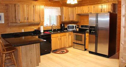 Log Cabin home on the Sturgeon River in Indian River