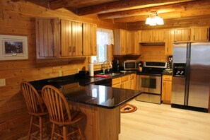 Fridge, microwave, oven, stovetop - Log Cabin home on the Sturgeon River in Indian River (Indian River)