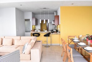 Enjoy a comfortable stay in this apartment with a cozy living area, dining space, and fully equipped kitchen.