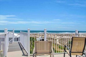 A balcony with two chairs overlooking a beach. - Pool, Hot Tub, 50 steps to sand, Pool table (St. Augustine)