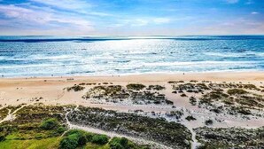 A beach with clear skies and calm waters. - Pool, Hot Tub, 50 steps to sand, Pool table (St. Augustine)