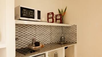 Fridge, microwave, stovetop, coffee/tea maker