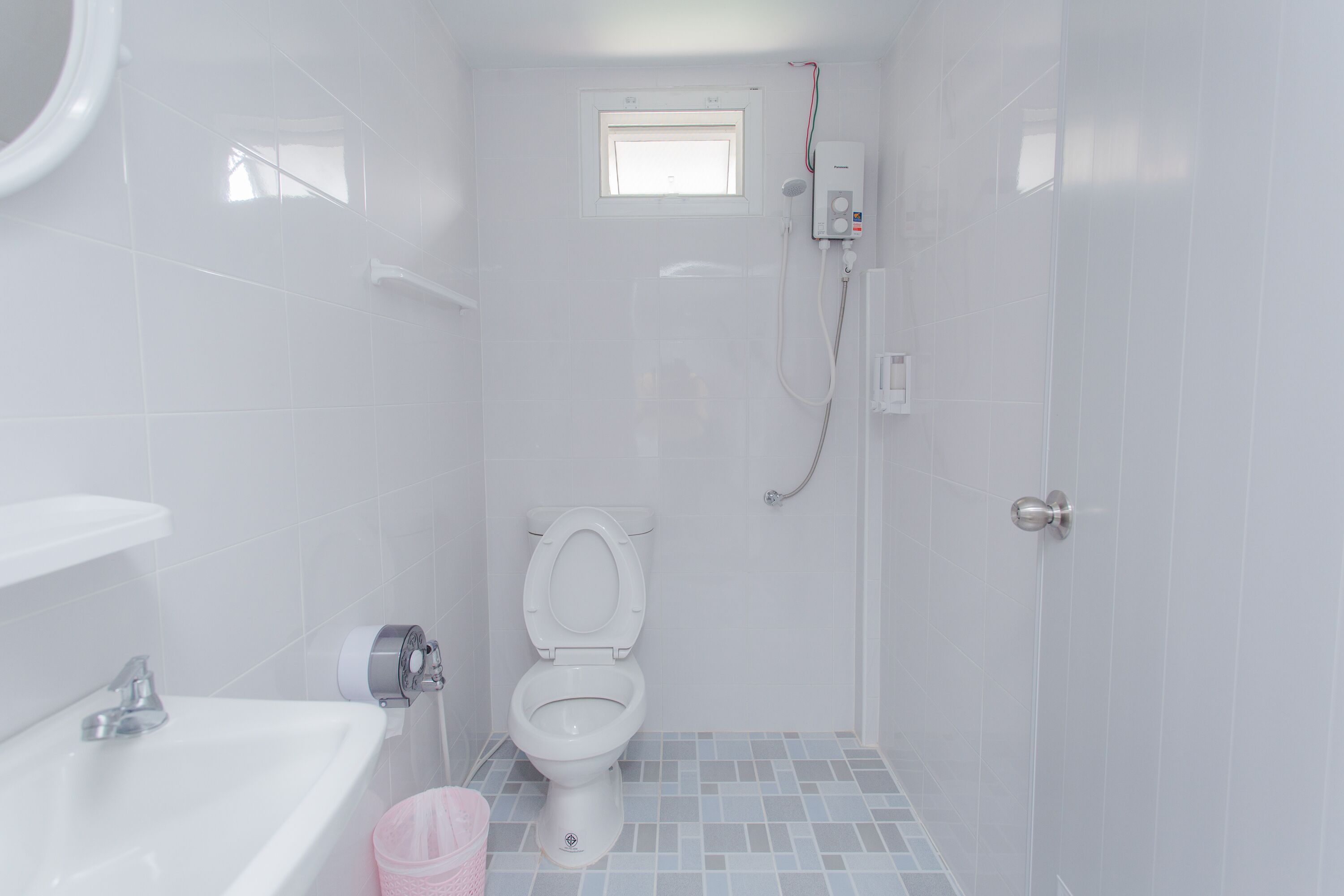 Shower, hair dryer, slippers, towels