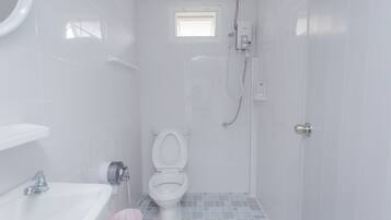 Shower, hair dryer, slippers, towels