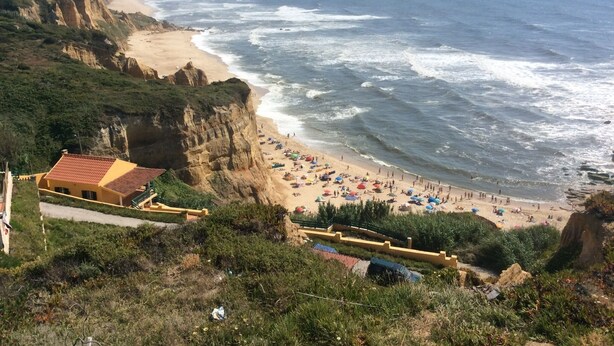 A coastal beach with cliffs, a sandy shore, and a building with a red roof. - 3 Bedroom villa with swimming pool in quiet village with countryside views (Alcobaca)