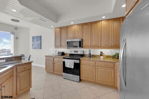 Fridge, microwave, oven, stovetop - Island Vacation Condo w/ Breathtaking Views At Waterside! First-Class Amenities! (Fort Myers Beach)