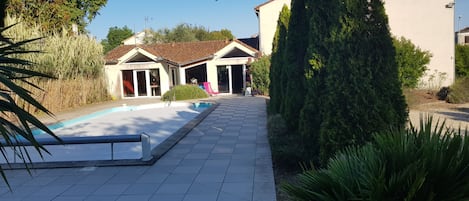 Seasonal outdoor pool, open 9:30 AM to 8:00 PM, pool loungers