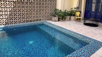 Outdoor pool, open 9:00 AM to 9:00 PM, sun loungers