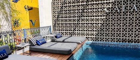 Outdoor pool, open 9:00 AM to 9:00 PM, pool loungers