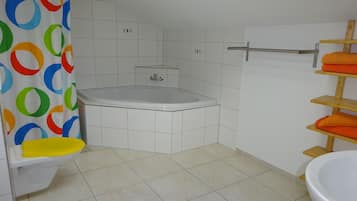 Apartment, 2 Bedrooms, Balcony (West) | Bathroom | Separate tub and shower, heated floors, towels, toilet paper