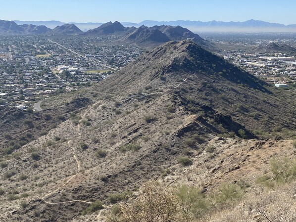 A mountainous landscape with a town in the valley below. - Private 2BR Casita • Fenced Yard • Dogs Welcome • Near Mayo (Phoenix)