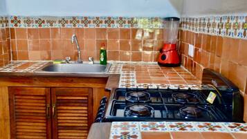 Fridge, microwave, stovetop, coffee/tea maker