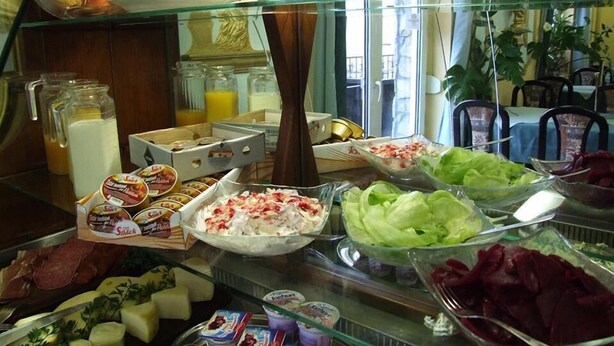 A breakfast buffet with various food items including fruits, vegetables, and dairy products. - Thermal Panzió Sárvár (Sarvar)