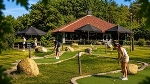 A miniature golf course with a gazebo, large rocks, and a well-maintained lawn. - 3 bedroom lovely home in Vlagtwedde (Vlagtwedde)