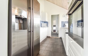 Fridge, stovetop, dishwasher, coffee/tea maker