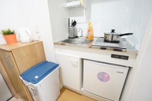 Appartement | Coin cuisine privé | Mini réfrigérateur, micro-ondes, plaque de cuisson