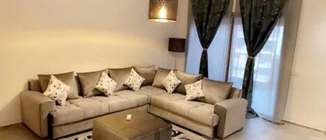 Apartment, 2 Bedrooms | Living room | Flat-screen TV