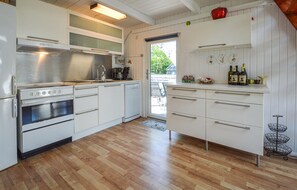 Fridge, stovetop, dishwasher, coffee/tea maker