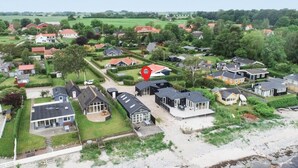 A residential area with houses, a marked location, and a beach. - Lovely home in Nyborg (Nyborg)