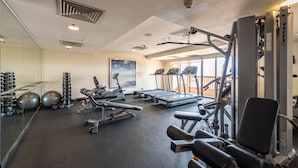 A gym with treadmills, weight machines, and exercise balls. - Sunway Resort By Himmel (Petaling Jaya)