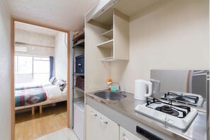 Apartment | Private kitchenette | Mini-fridge, microwave, stovetop, electric kettle - Terry's Apartment Namba South I V04A (Osaka)