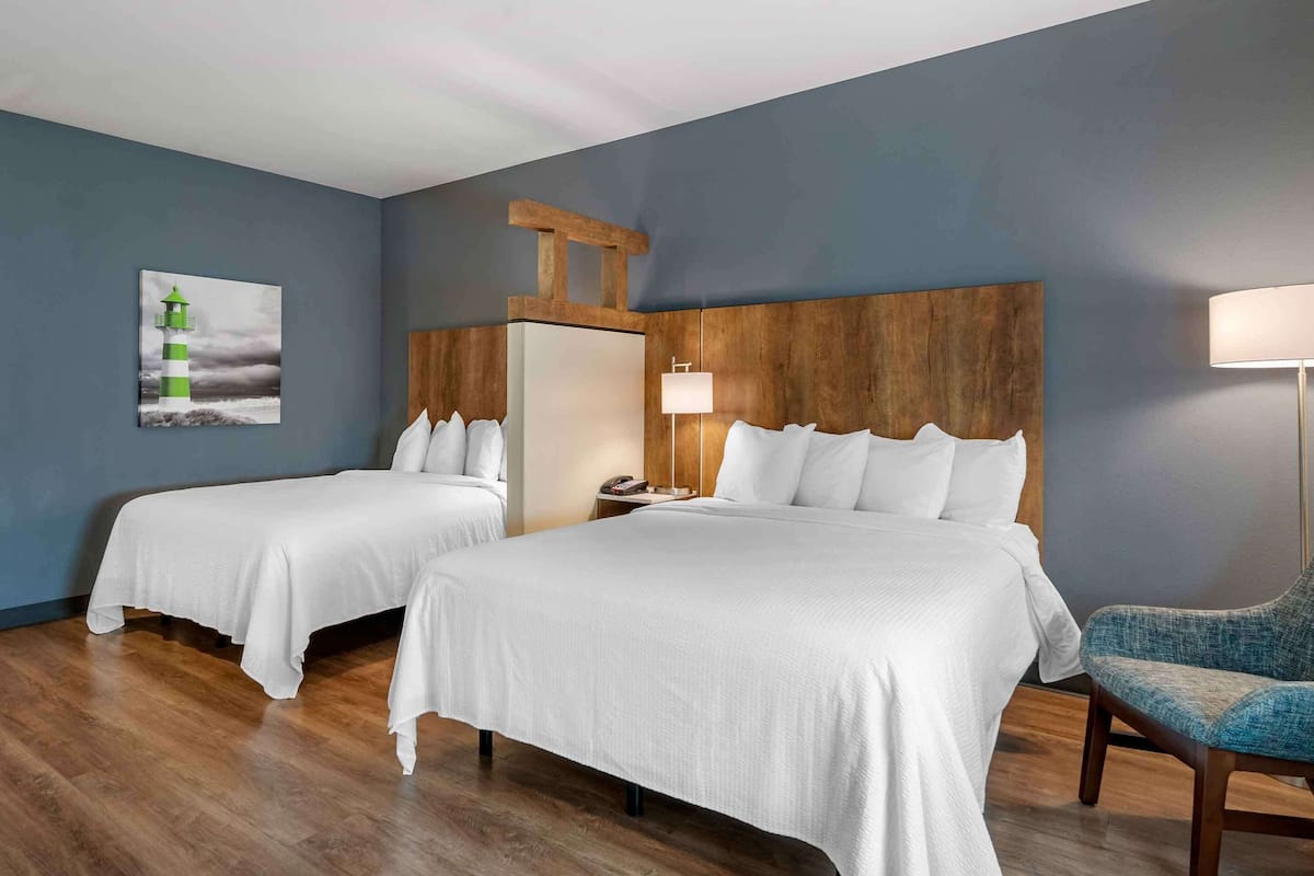Premium bedding, desk, laptop workspace, iron/ironing board