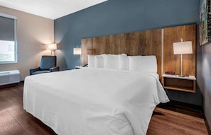 Premium bedding, desk, laptop workspace, iron/ironing board