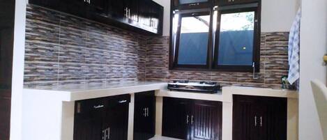 Fridge, stovetop, toaster, cookware/dishes/utensils