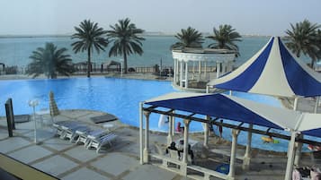 Outdoor pool, pool umbrellas, sun loungers
