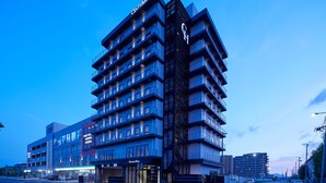 A modern multi-story hotel with a prominent 'CENTURION' sign, featuring a unique facade with balconies and a corner entrance. - Centurion Hotel & Spa Vintage Kobe (Kobe)