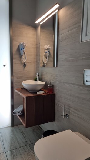 Family Room, Sea View | Bathroom | Shower, hair dryer, towels
