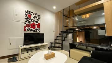 City Condo (4A) | Living room | 32-inch flat-screen TV with cable channels, TV