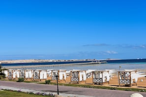 On the beach, sun loungers, beach towels