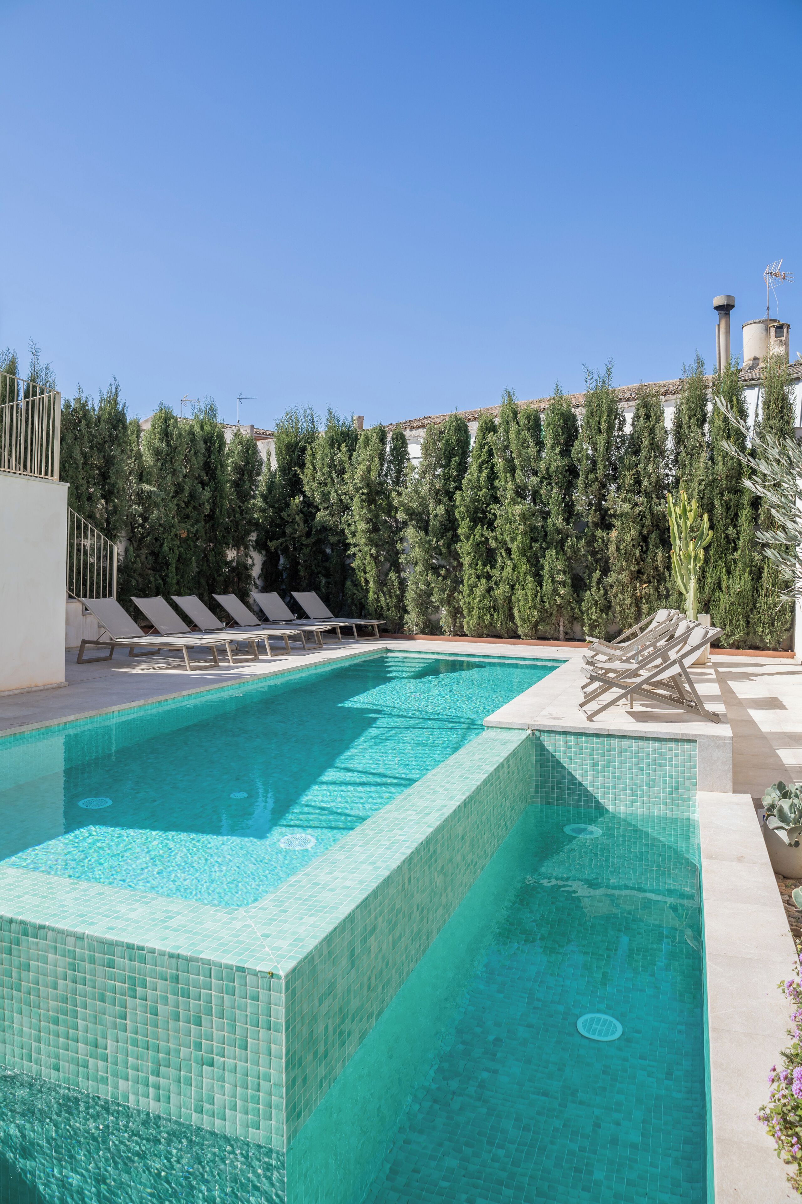 indoor pool, outdoor pool, pool umbrellas, pool loungers