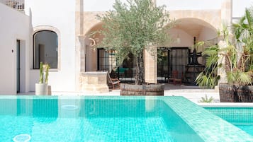 Indoor pool, outdoor pool, pool umbrellas, pool loungers