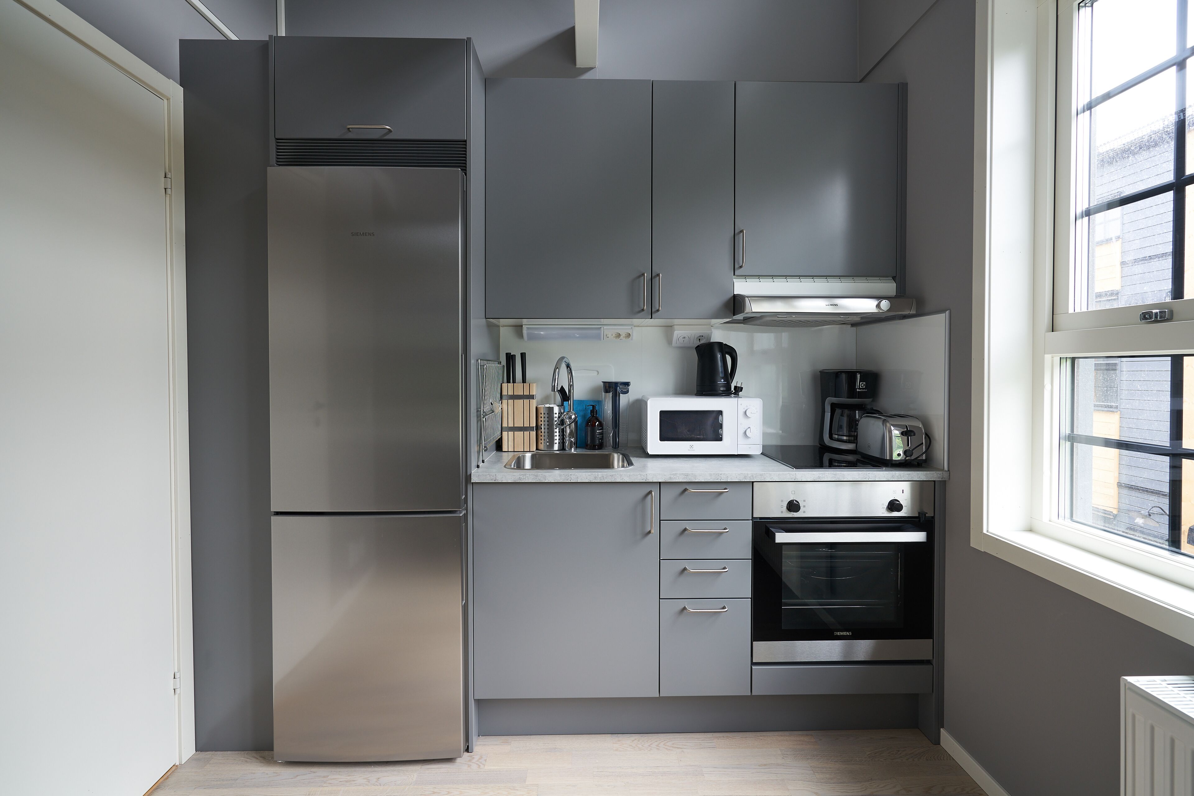 Monolocale, 2 letti singoli (Loft) | Cucina privata | Frigorifero, microonde, forno, piano cottura