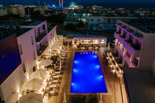 Seasonal outdoor pool, open 8:00 AM to 6:30 PM, pool umbrellas - Cosmo Napa Hotel (Ayia Napa)