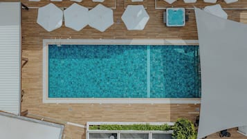 Seasonal outdoor pool, open 10:00 AM to 7:00 PM, pool umbrellas